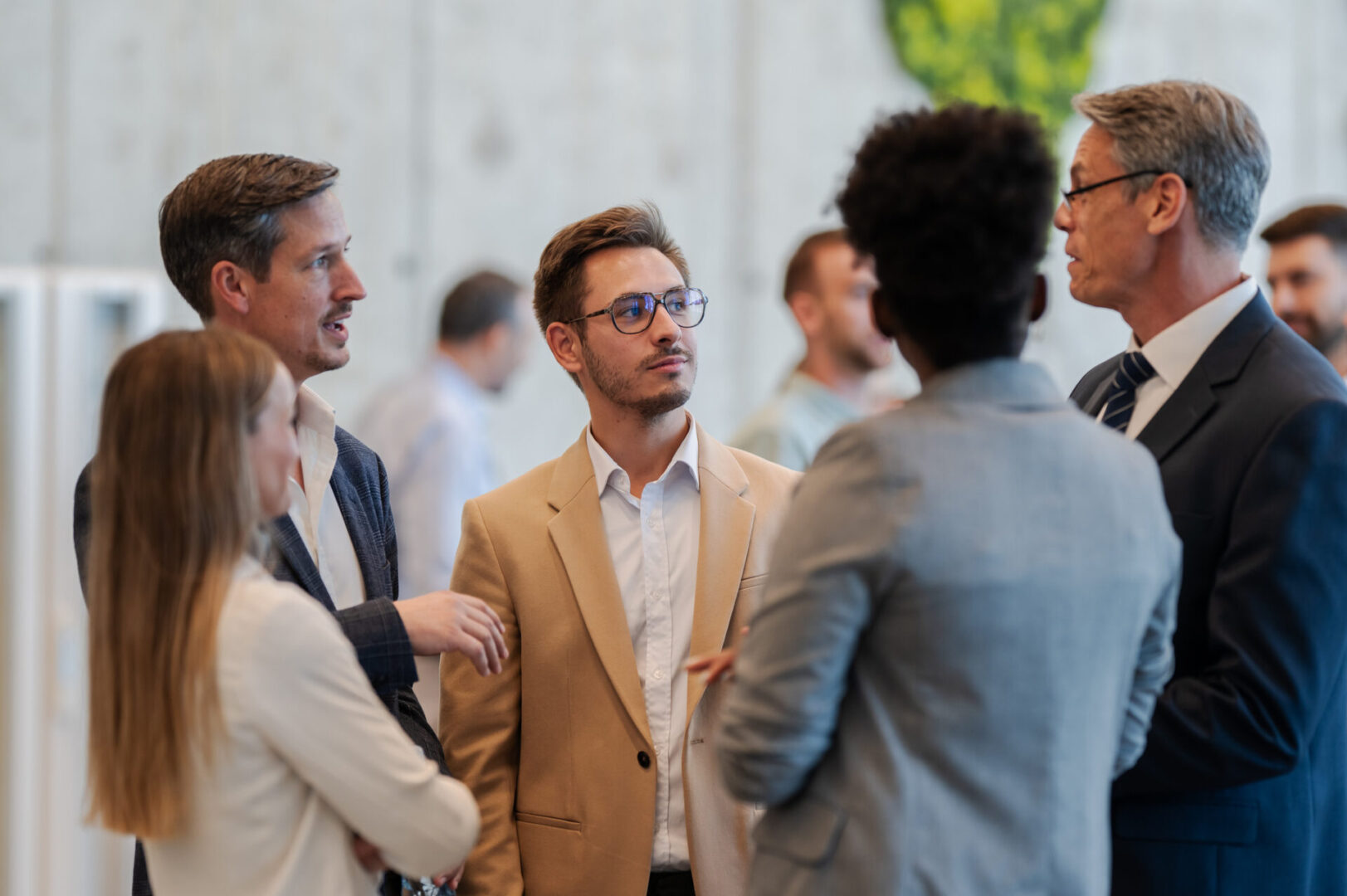 Group of professionals networking at business event
